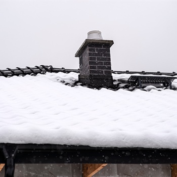 How Heavy Snowfall and Blizzards Damage Your Roof and Home
