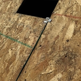 Close-up of new plywood roof sheathing installation