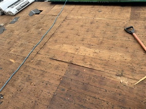 Exposed roof decking after shingle removal in Burnsville MN