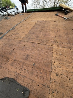 Roof sheathing inspection during Burnsville roof replacement project