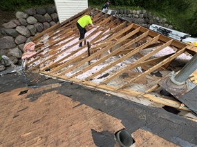 Damaged roof decking removed during reroofing project in Burnsville