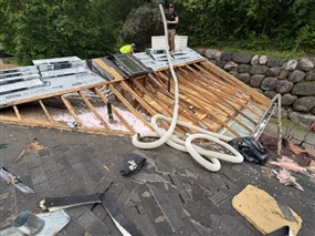 Roofing materials staged on roof during Burnsville replacement project
