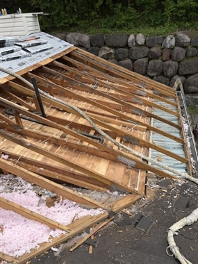 Exposed roof framing during complete roof replacement in Burnsville