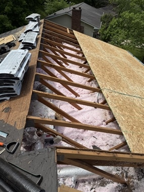 Roof rafters exposed during residential reroofing project